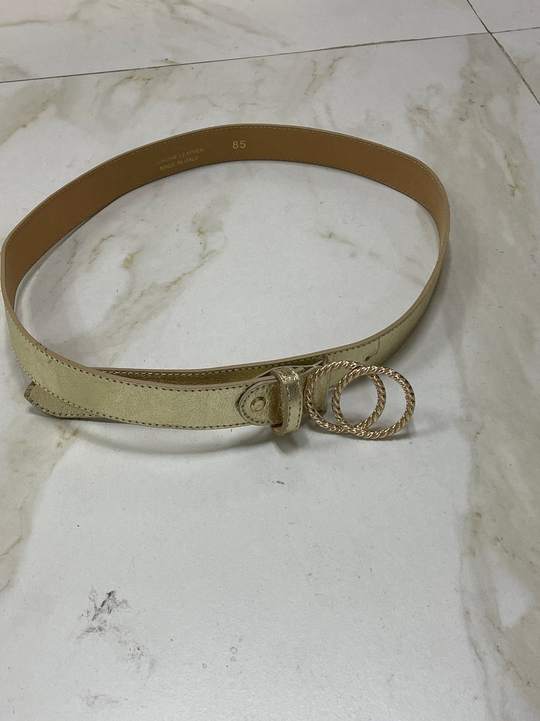 Ceinture dorée bouclés entrelacées