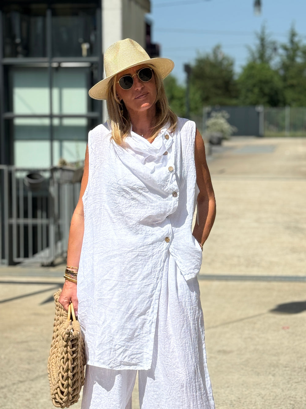 Blouse asymétrique col drapé boutonné