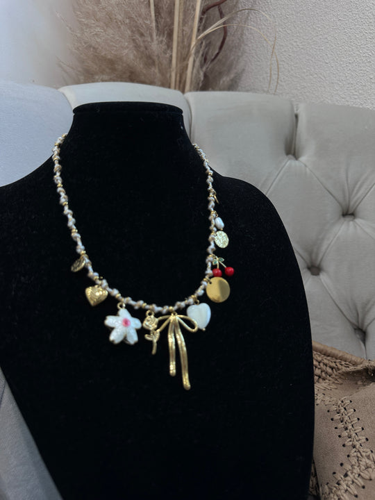 Collier doré noeud fleur