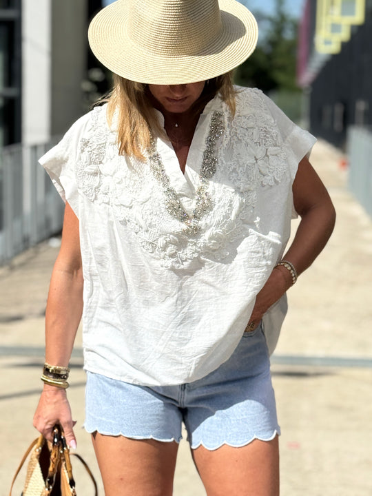 Top blanc col V strass