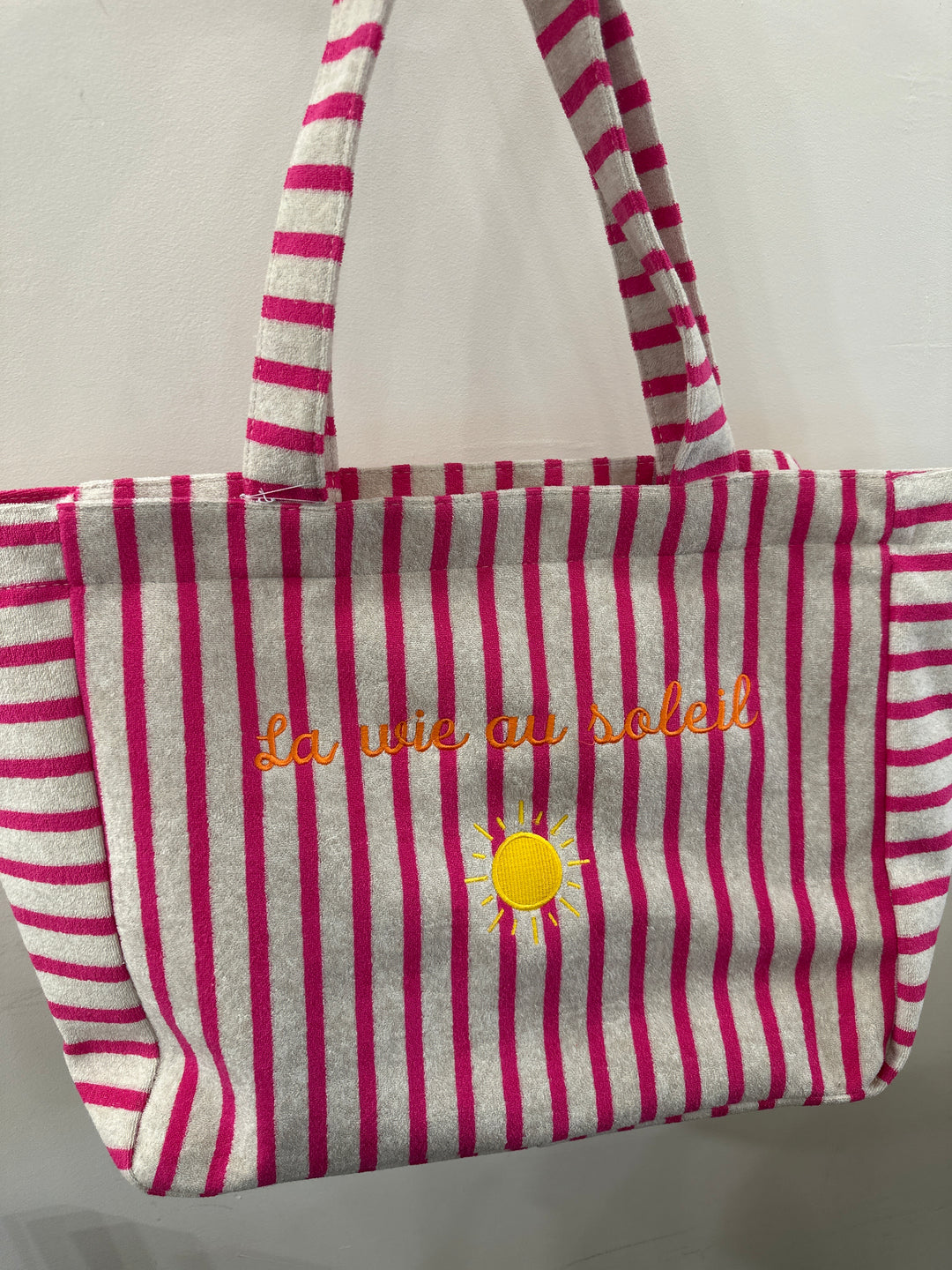 Sac beige à rayures roses