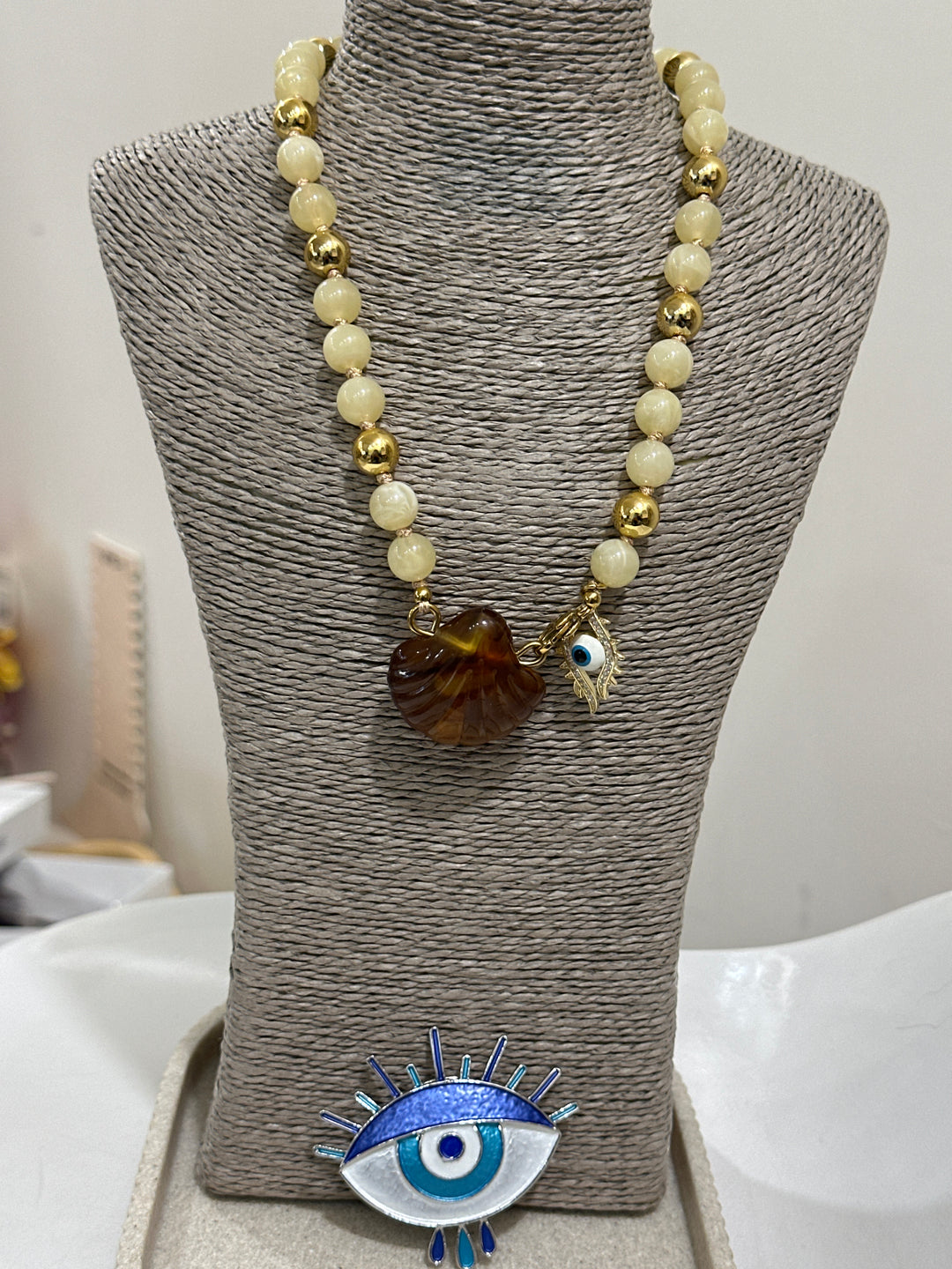 Set collier coquillage œil + broche oeil