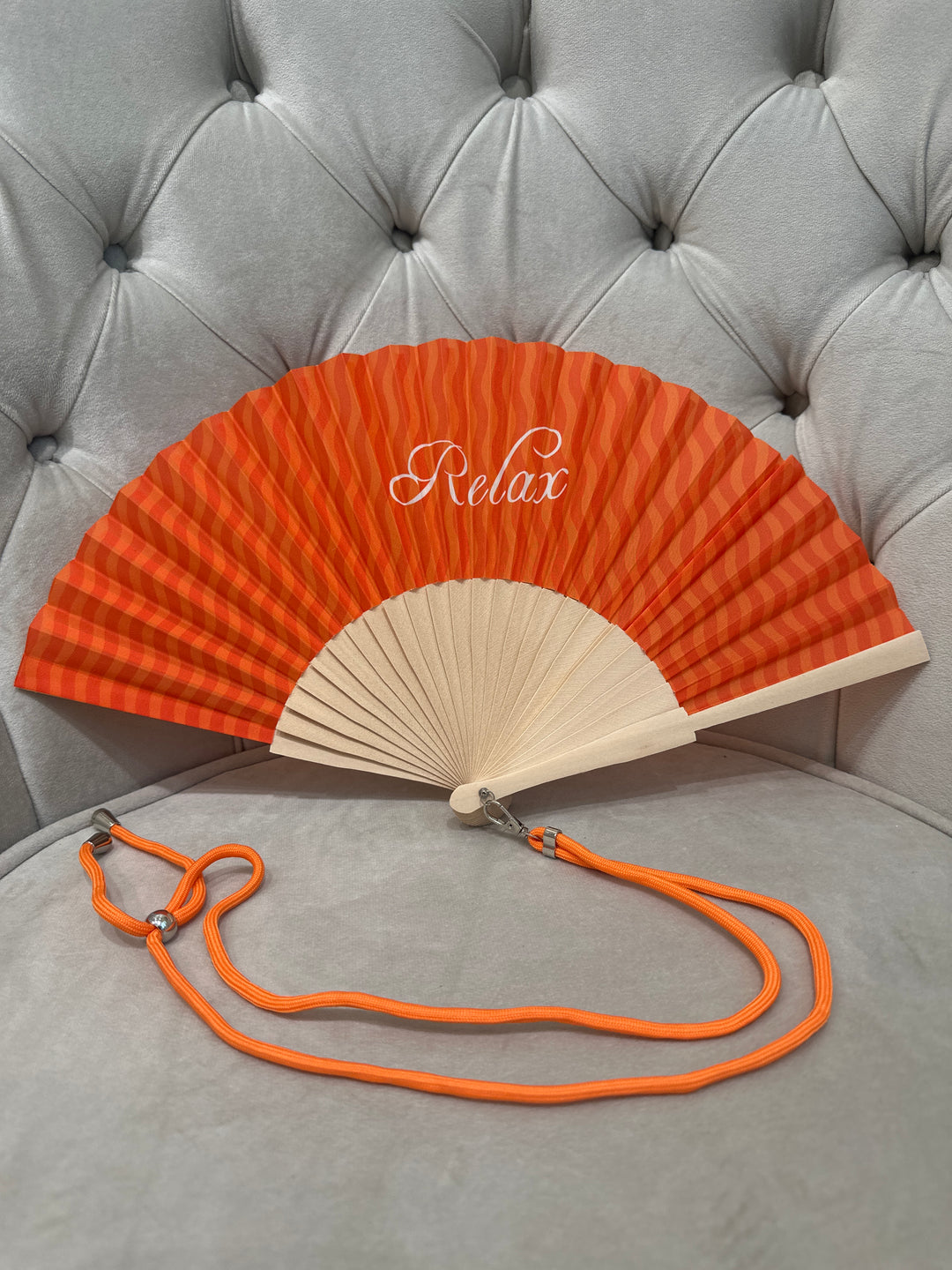 Eventail orange "relax" avec corde