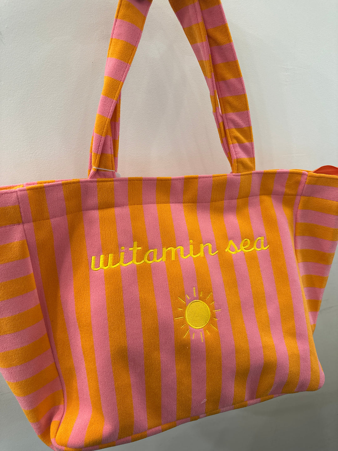 Sac orange à rayures roses